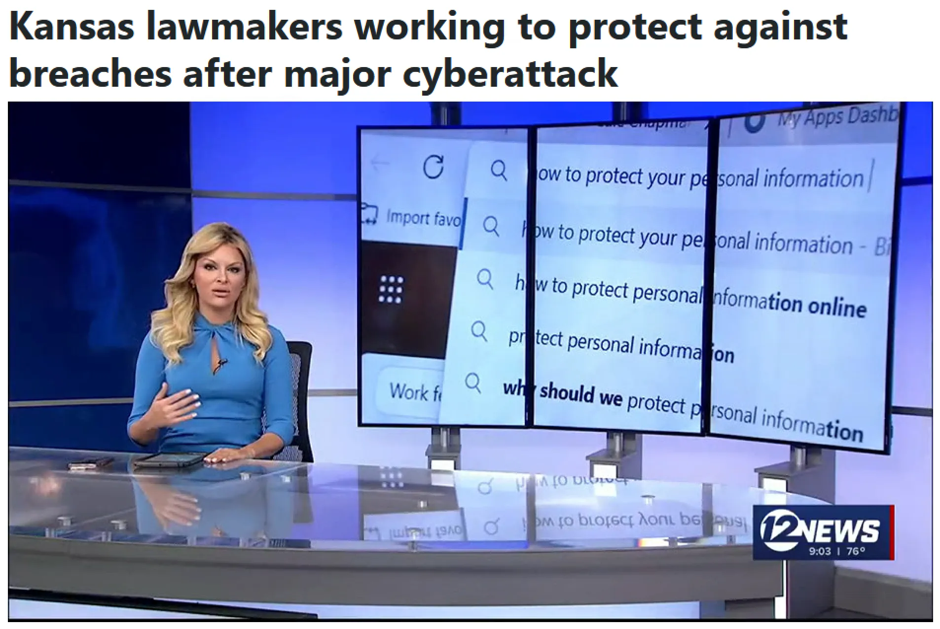 A female newscaster sits at a desk during a local tv news broadcast